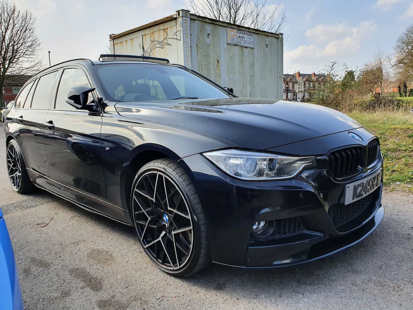 Shiny black BMW after a wash at Marlow's Street Car Wash